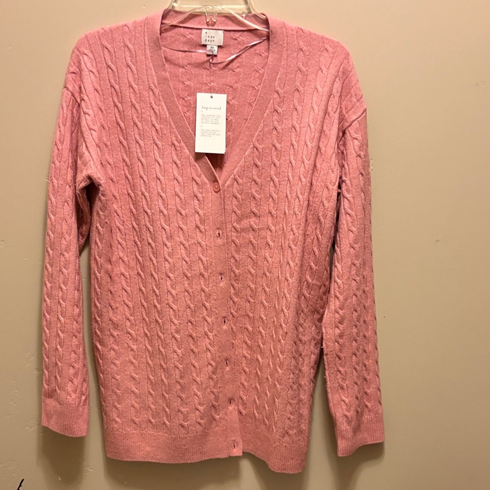 A New Day cardigan in pink made with 70% recycled polyester.